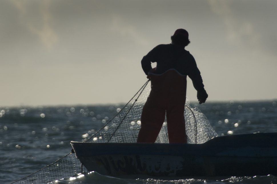 Fisherman with a gillnet. Photo by Chris Johnson.